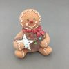 Gingerbread Man Holding A Star Figurine