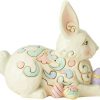 Laying down, this sweet bunny is as relaxed as he is happy. Surrounded by painted Easter eggs, this little rabbit is ready for showers and flowers.